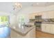 Bright kitchen boasts granite countertops, stainless appliances, and an island at 105 Villa Mar Dr. # C-1, Myrtle Beach, SC 29579