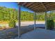 Comfortable covered patio surrounded by lush trees and scenic views at 105 Villa Mar Dr. # C-1, Myrtle Beach, SC 29579