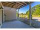 Covered patio offering a view of the well-maintained lawn and lush landscaping at 105 Villa Mar Dr. # C-1, Myrtle Beach, SC 29579