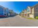 A row of townhomes line the street, each with a two-car garage and pristine landscaping at 105 Villa Mar Dr. # C-1, Myrtle Beach, SC 29579