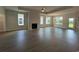 Open-concept living room with a fireplace, hardwood floors, and natural light at 1051 Laconic Dr., Myrtle Beach, SC 29588