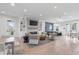 Bright clubhouse living room featuring a fireplace, bar area, and ample seating at 1056 Laconic Dr., Myrtle Beach, SC 29588