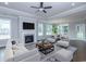 Elegant living room with a fireplace, comfortable seating, and views into the dining area at 1059 Laconic Dr., Myrtle Beach, SC 29588