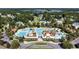 Aerial view of the neighborhood pool with slides, splash pads, and many seating areas at 1232 Needle Grass Loop, Myrtle Beach, SC 29579