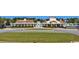 Exterior view of the neighborhood pool and recreation center with sidewalks and parking at 1232 Needle Grass Loop, Myrtle Beach, SC 29579