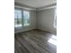 Bedroom with hardwood floors and lots of light at 1237 Lady Bird Way, North Myrtle Beach, SC 29582