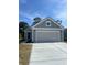 Charming single-story home with gray siding, white trim, and a spacious two-car garage at 1237 Lady Bird Way, North Myrtle Beach, SC 29582