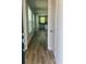 Elegant foyer showcasing hardwood floors and a view of the open-concept kitchen at 1237 Lady Bird Way, North Myrtle Beach, SC 29582