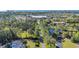 Expansive aerial shot featuring the property's location amongst mature trees and manicured lawns, with a glimpse of nearby amenities at 1313 Villa Marbella Ct. # 4-102, Myrtle Beach, SC 29572