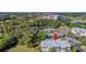 Stunning aerial view of the property highlighting the complex location near tennis courts, waterfront, and lush landscaping at 1313 Villa Marbella Ct. # 4-102, Myrtle Beach, SC 29572