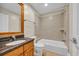 Well-lit bathroom featuring a vanity with granite countertop, toilet, and a tiled shower-over-tub combination for convenience at 1313 Villa Marbella Ct. # 4-102, Myrtle Beach, SC 29572