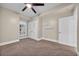 Cozy bedroom with neutral walls and carpet, features a ceiling fan, natural light from a window, and closet space at 1313 Villa Marbella Ct. # 4-102, Myrtle Beach, SC 29572
