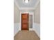 Condo unit entrance featuring tile floors, wainscoting and a transom window at 1313 Villa Marbella Ct. # 4-102, Myrtle Beach, SC 29572