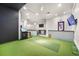 Indoor golf simulator with putting green and golf monitor at 1313 Villa Marbella Ct. # 4-102, Myrtle Beach, SC 29572