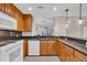 Kitchen featuring granite countertops, light wood cabinets and white appliances at 1313 Villa Marbella Ct. # 4-102, Myrtle Beach, SC 29572