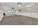 Expansive living room with access to a screened-in patio area and fireplace at 1313 Villa Marbella Ct. # 4-102, Myrtle Beach, SC 29572