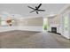 Open living area featuring fireplace, window view, and a connected kitchen at 1313 Villa Marbella Ct. # 4-102, Myrtle Beach, SC 29572