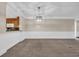 Spacious living room with modern lighting fixture and open space at 1313 Villa Marbella Ct. # 4-102, Myrtle Beach, SC 29572