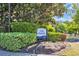 Community sign for Villa Marbella nestled in mature landscaping at 1313 Villa Marbella Ct. # 4-102, Myrtle Beach, SC 29572