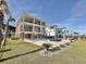 Expansive backyard with a private pool, stone patio, and lush green lawn at 133 Serenity Point Dr., Little River, SC 29566