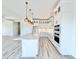 New kitchen with white cabinets, quartz countertops, and modern appliances at 133 Serenity Point Dr., Little River, SC 29566