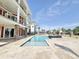 A luxurious backyard with an in-ground swimming pool and a stone patio with lake views at 133 Serenity Point Dr., Little River, SC 29566