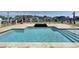 An in-ground swimming pool and spa are highlighted with serene water and stone surroundings at 133 Serenity Point Dr., Little River, SC 29566