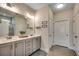 Bathroom features double sinks with gray cabinets, a walk-in shower, and ample storage at 233 Astoria Park Loop, Conway, SC 29526