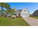 Charming single-story home with a well-manicured lawn and inviting curb appeal in a residential community at 233 Astoria Park Loop, Conway, SC 29526