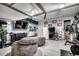 Finished garage space with gym equipment, television, and beanbag chairs at 233 Astoria Park Loop, Conway, SC 29526