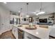 Open-concept kitchen with stainless steel appliances and a view into the spacious living area at 233 Astoria Park Loop, Conway, SC 29526