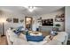 Cozy living room featuring stylish decor, hardwood floors, and decorative shelves at 233 Astoria Park Loop, Conway, SC 29526