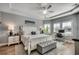 Spacious main bedroom with tray ceiling, a ceiling fan, an ensuite bathroom and a work space at 233 Astoria Park Loop, Conway, SC 29526