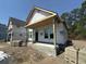 A new home under construction features a front porch at 2611 Painted Trillium Ct., Myrtle Beach, SC 29579