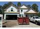 A new home under construction features a two-car garage and front porch at 2611 Painted Trillium Ct., Myrtle Beach, SC 29579