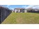 Spacious backyard with well-maintained grass, fence and screened-in porch at 2771 Eclipse Dr., Myrtle Beach, SC 29577