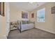 Cozy bedroom with neutral walls, a comfortable bed, and a bright window with a view of the neighborhood at 2771 Eclipse Dr., Myrtle Beach, SC 29577