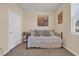 Comfortable bedroom with neutral walls, carpet, and a bright window with a view of the neighborhood at 2771 Eclipse Dr., Myrtle Beach, SC 29577