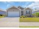 Charming single-story home with a well-maintained lawn, attached garage, and classic architectural details at 2771 Eclipse Dr., Myrtle Beach, SC 29577
