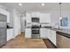 Bright kitchen showcases stainless steel appliances, granite countertops, and light wood flooring at 2771 Eclipse Dr., Myrtle Beach, SC 29577