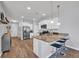 Modern kitchen boasts granite countertops, stainless appliances, and a breakfast bar with seating at 2771 Eclipse Dr., Myrtle Beach, SC 29577