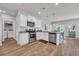 Well-lit kitchen features granite countertops, stainless steel appliances, and a view into the dining area at 2771 Eclipse Dr., Myrtle Beach, SC 29577