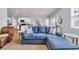 Open-concept living area featuring a plush blue sectional sofa and stylish decor at 2771 Eclipse Dr., Myrtle Beach, SC 29577