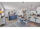Bright, open-concept living area with a dining space, kitchen bar, and comfortable sofa at 2771 Eclipse Dr., Myrtle Beach, SC 29577