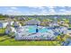 An aerial view of the community pool, showing lounge chairs, tables, and a surrounding neighborhood at 2771 Eclipse Dr., Myrtle Beach, SC 29577
