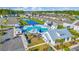 Aerial view of a community pool and amenity center with a pond and manicured landscaping in a residential neighborhood at 2771 Eclipse Dr., Myrtle Beach, SC 29577