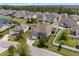 Aerial view of a residential neighborhood with well-maintained homes, private pools, and lush greenery at 3110 Bramble Glen Dr., Myrtle Beach, SC 29579