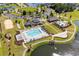 Aerial view of a community with a pool, clubhouse, parking, and lush greenery at 3110 Bramble Glen Dr., Myrtle Beach, SC 29579