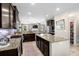 Modern kitchen with granite countertops, stainless steel appliances and dark wood cabinetry at 3110 Bramble Glen Dr., Myrtle Beach, SC 29579