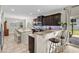 A modern kitchen with granite countertops, dark cabinets and stainless steel appliances at 3110 Bramble Glen Dr., Myrtle Beach, SC 29579